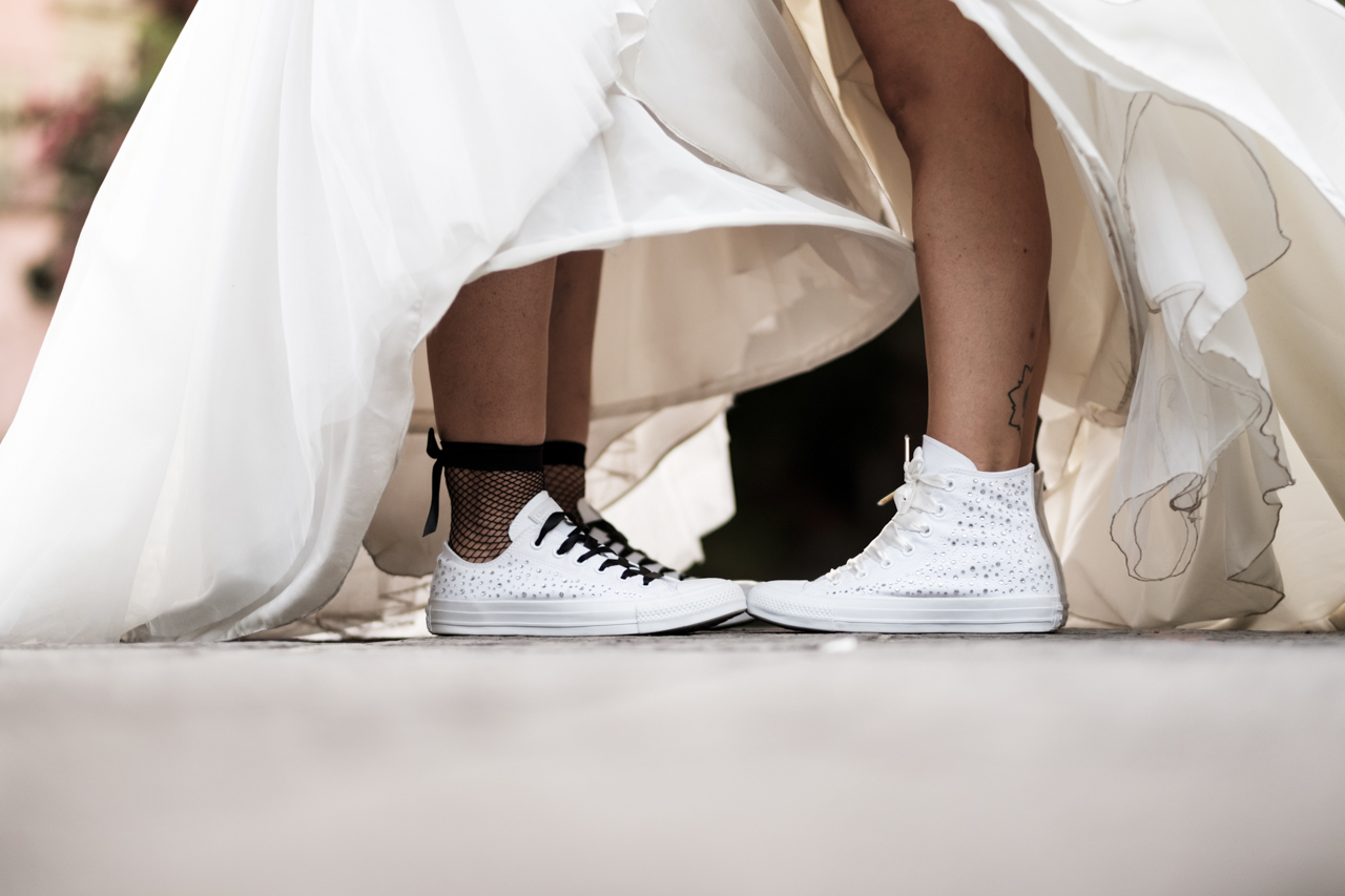 Rainbow Italian wedding in Cagliari two brides colorful bright colors short hair white dresses sneakers