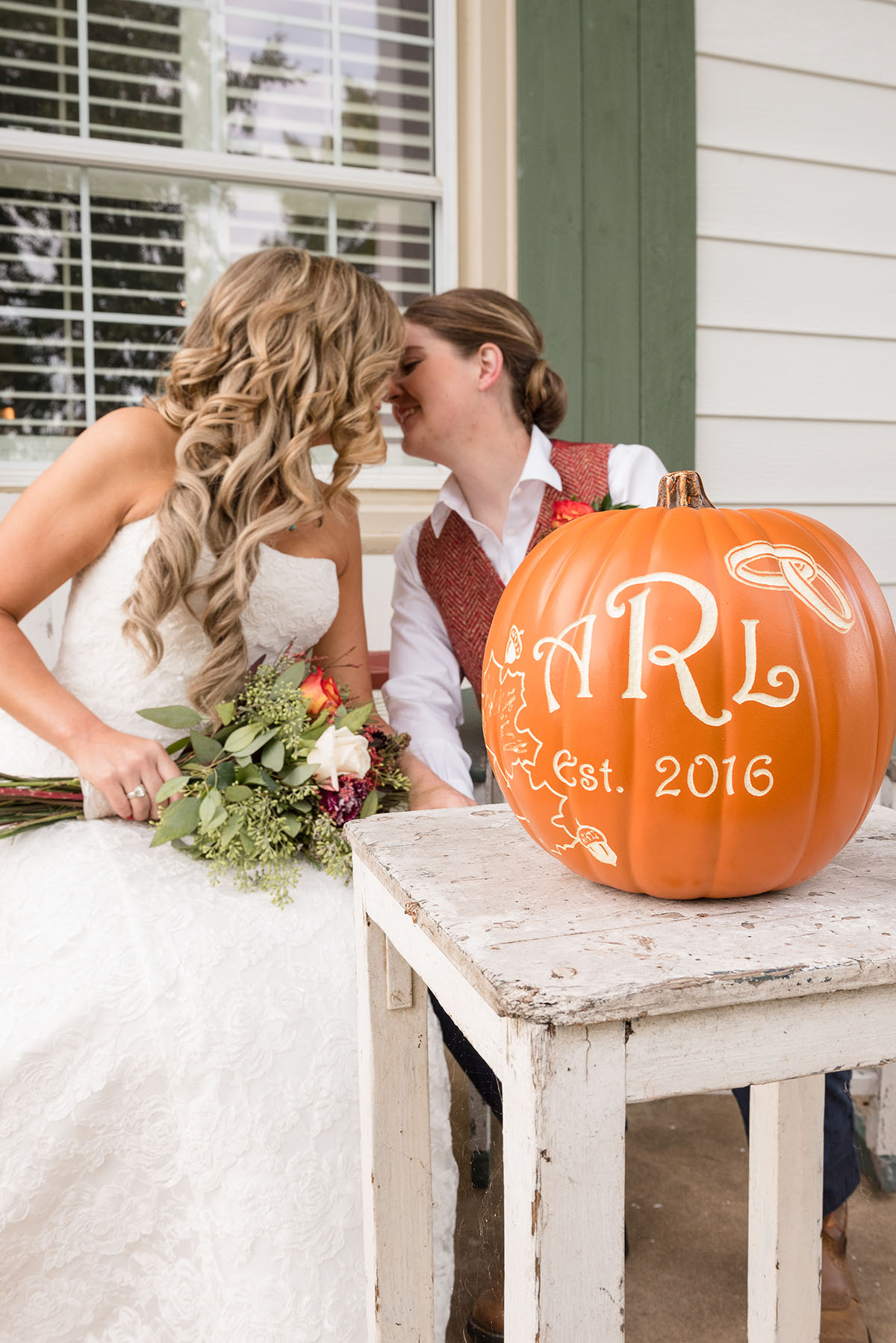 Rustic traditional Southern fall wedding in a barn veil white dress cowboy boots vest Saint Louis two brides pumpkin