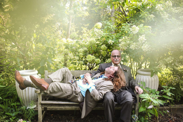 Unique and nostalgic backyard wedding after 29 years together two grooms cuddling