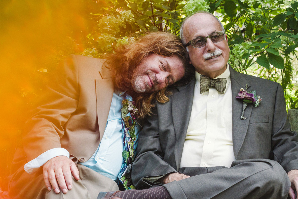 Unique and nostalgic backyard wedding after 29 years together cuddling