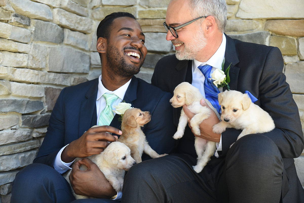 Nature and puppies wedding inspiration two grooms black tuxedos tux blue and green ties