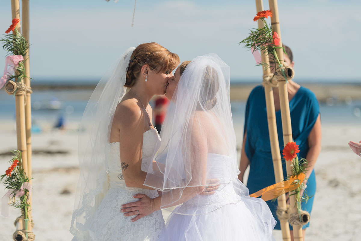 Beach wedding in Kennebunkport, Maine two brides long white dresses summer bouquets vows just married