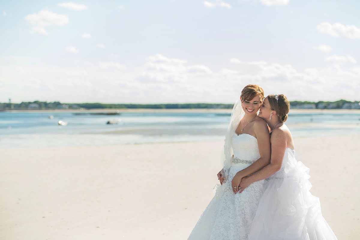 Beach wedding in Kennebunkport, Maine two brides long white dresses summer bouquets