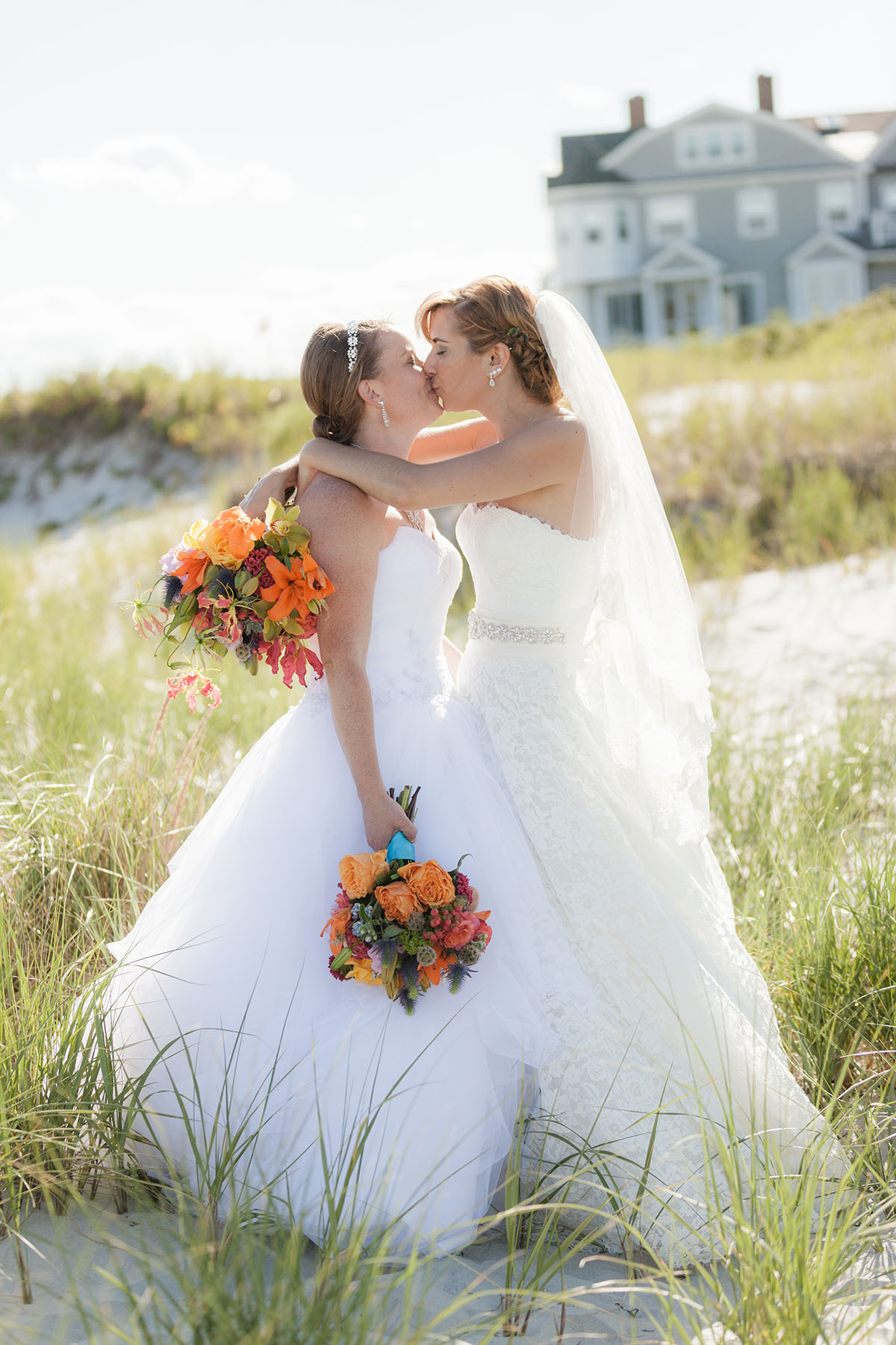 Beach wedding in Kennebunkport, Maine two brides long white dresses summer bouquets