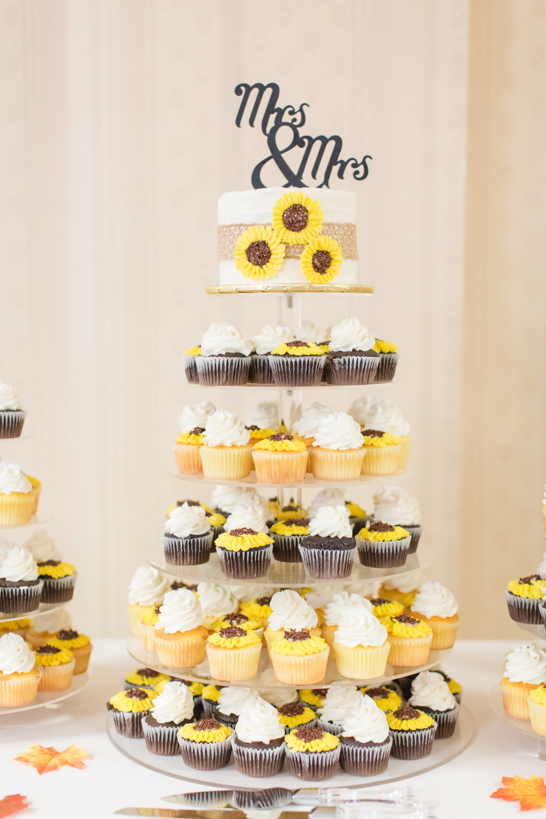 Bright fall sunflower wedding Mrs. and Mrs. cake dessert table