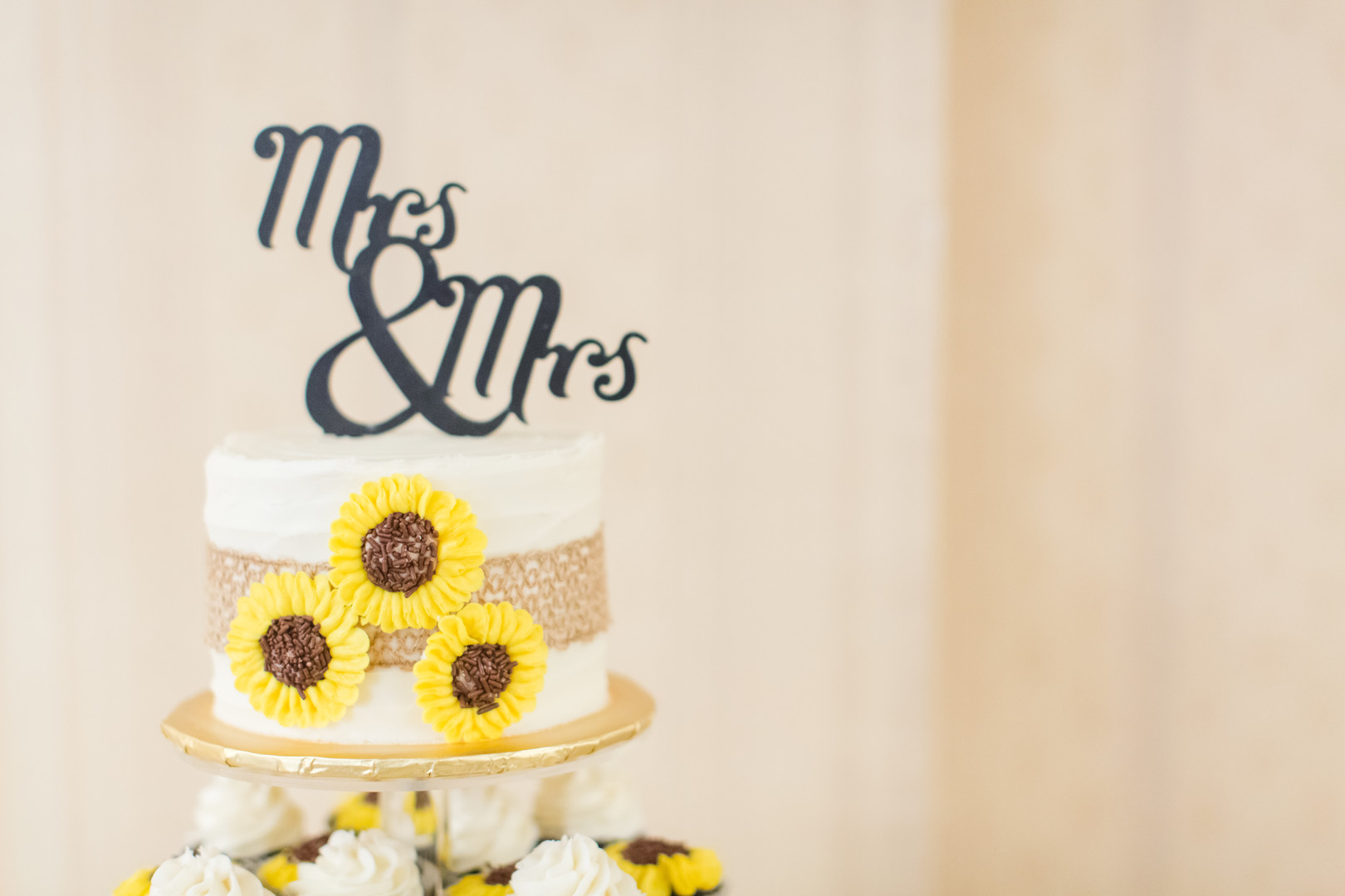 Bright fall sunflower wedding Mrs. and Mrs. wedding cake