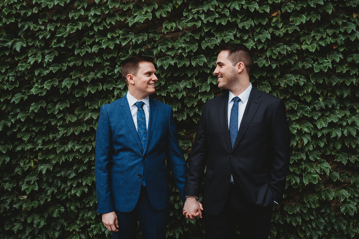 Chicago Riverwalk intimate wedding black blue tuxedo black tie two grooms