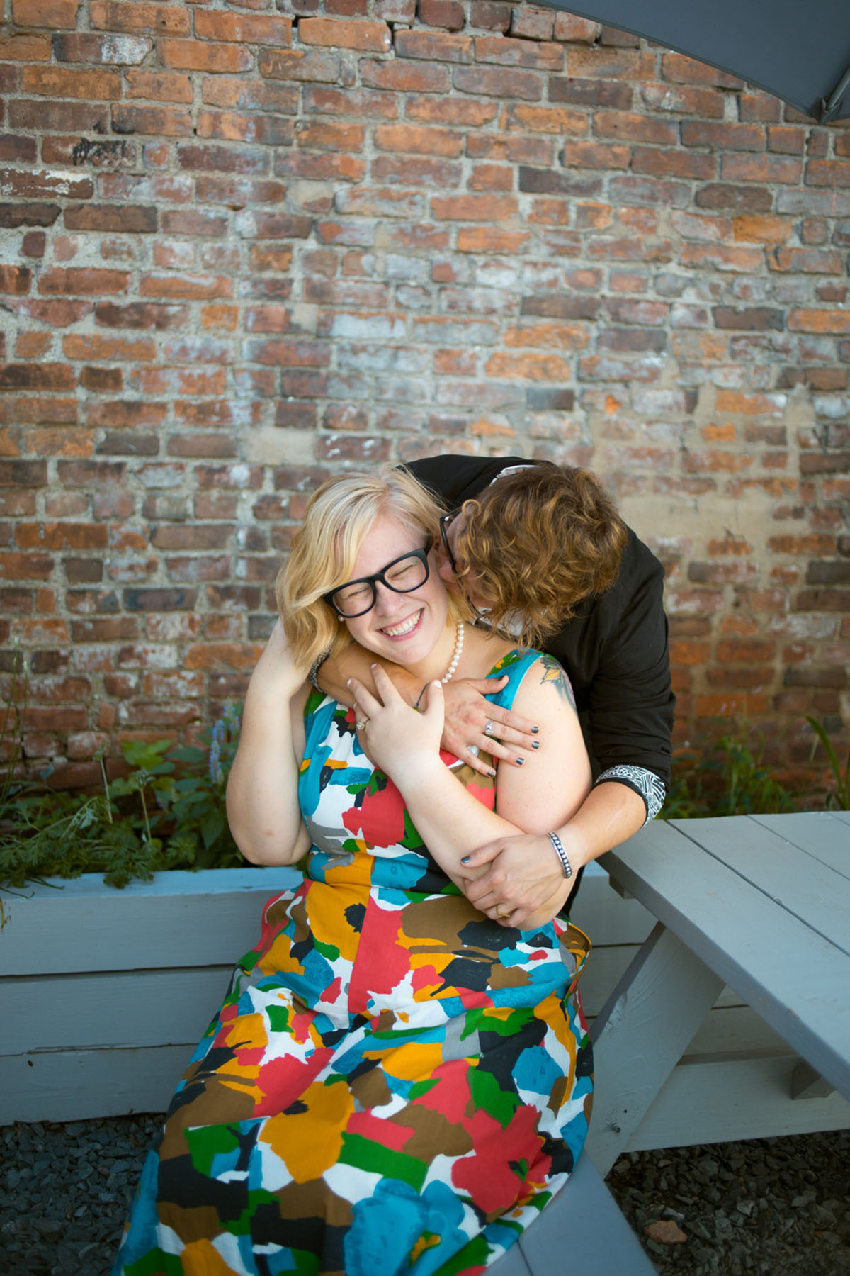 Cozy courthouse wedding with coffeehouse reception two brides colorful Modcloth dress glasses black blazer