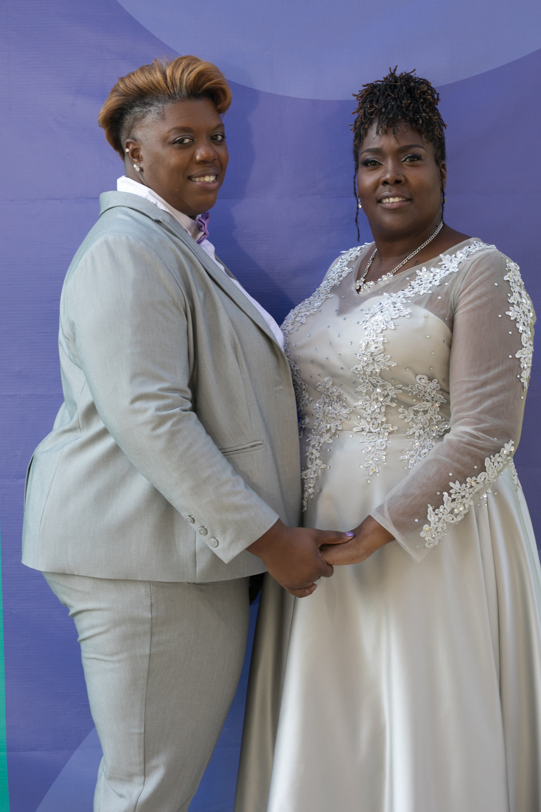 Fun purple and silver wedding in Bethesda, Maryland two brides lesbian long sleeve wedding dress silver tuxedo