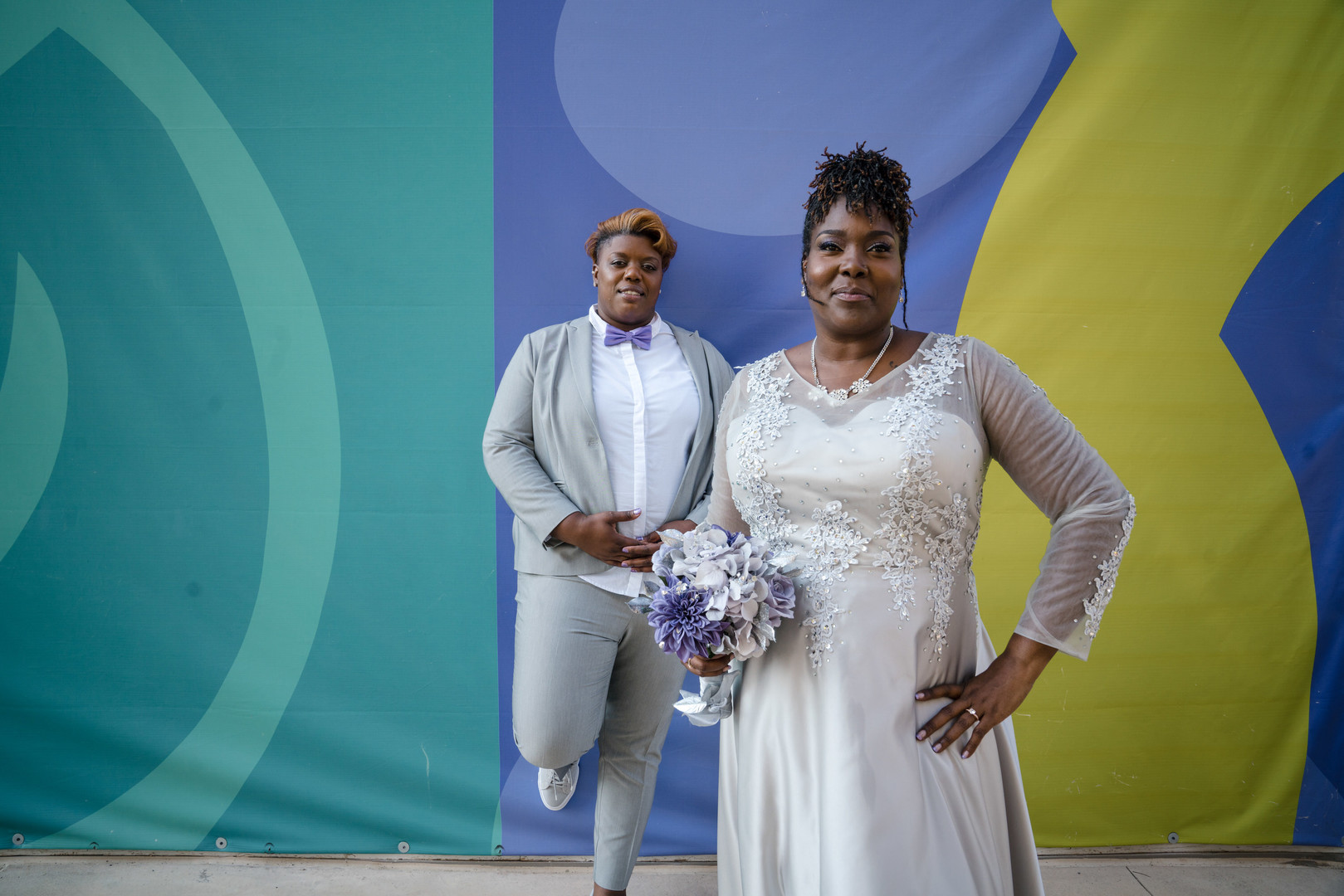 Fun purple and silver wedding in Bethesda, Maryland two brides lesbian long sleeve wedding dress silver tuxedo