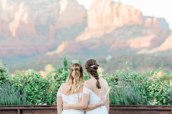 Hilltop wedding in the mountains of Sedona, Arizona two brides matching white dresses Red Rocks