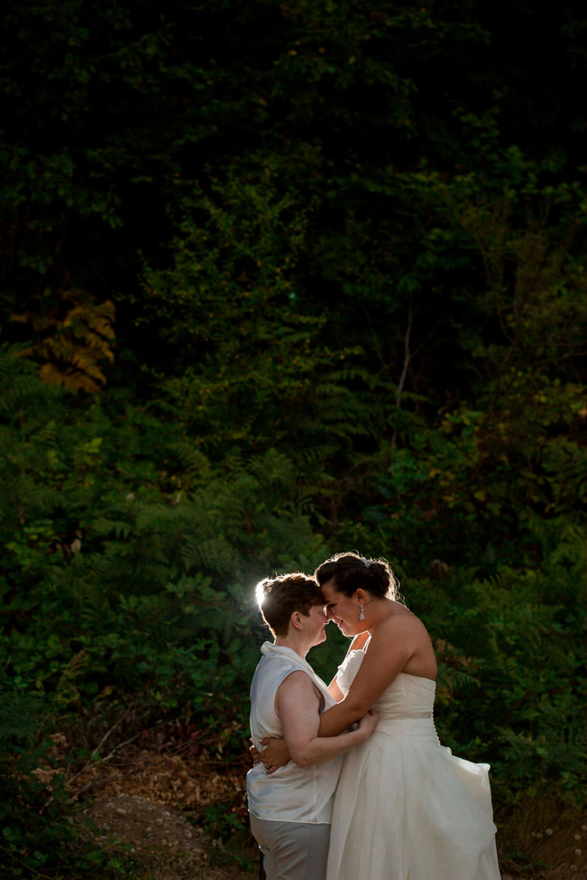 Purple Northwest backyard wedding two brides white dress white tuxedo woods intimate