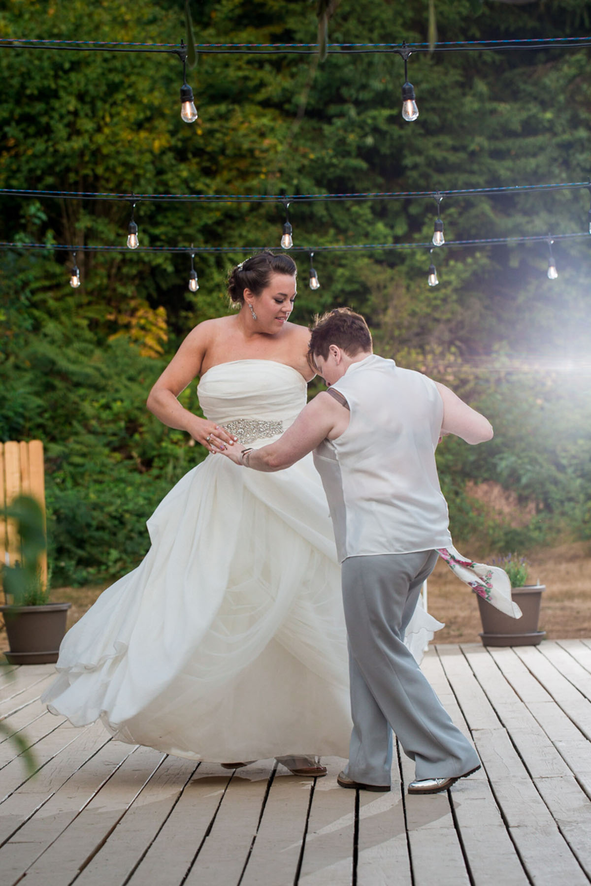 Purple Northwest backyard wedding two brides white dress white tuxedo first dance