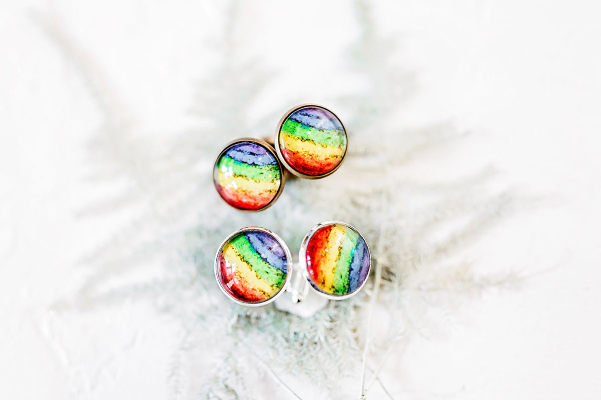 Rainbow double wedding inspiration two brides two grooms Pride colorful rainbow rings