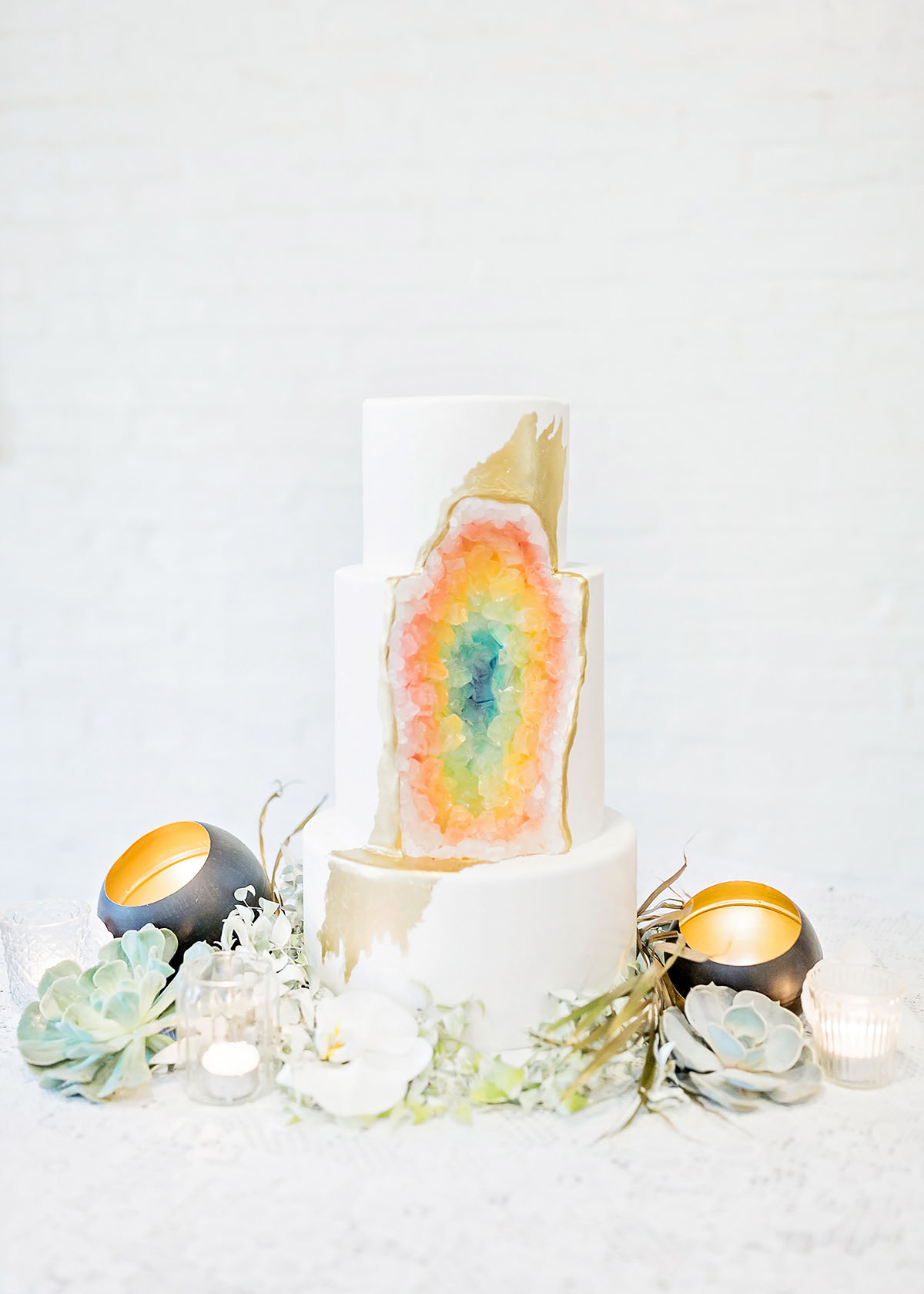 Rainbow double wedding inspiration two brides two grooms Pride colorful cake geode