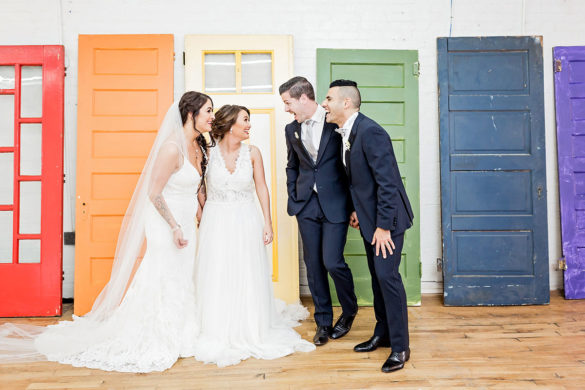 Rainbow double wedding inspiration two brides two grooms Pride colorful white dresses black tuxedos rainbow doors