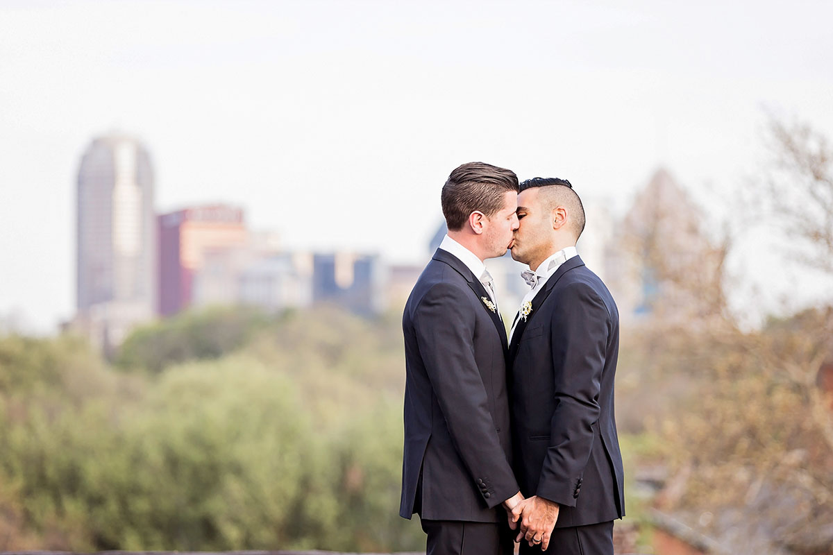 Rainbow double wedding inspiration two brides two grooms Pride colorful kiss skyline