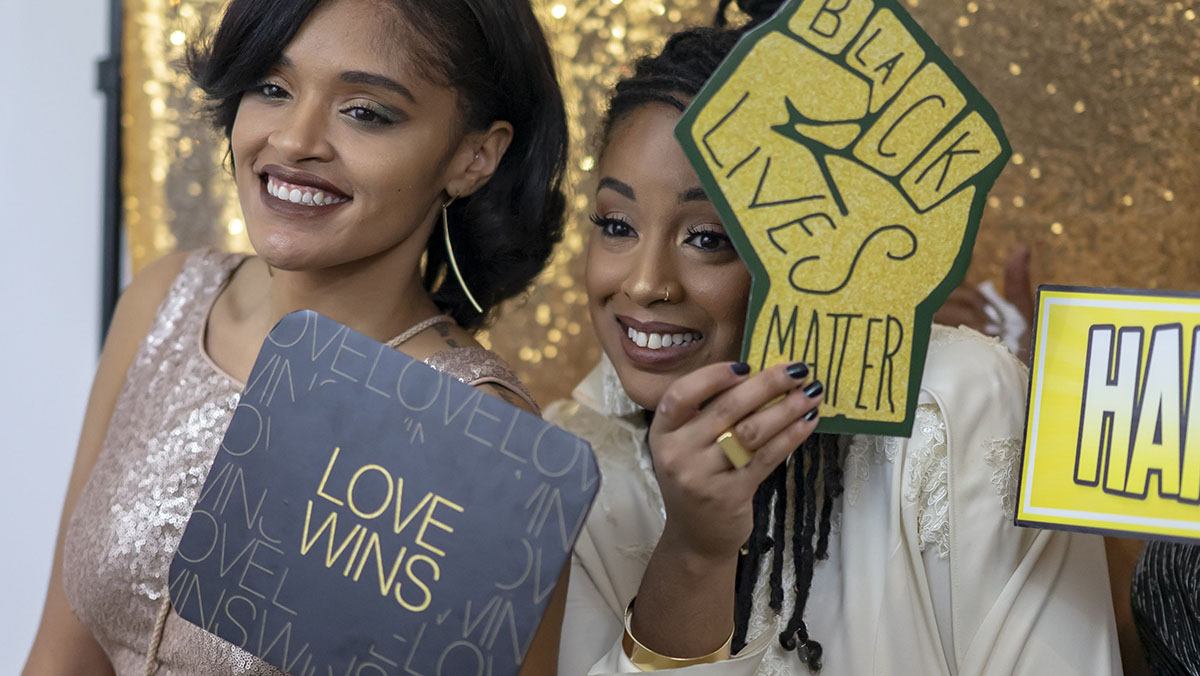 Artistic, cultural wedding in an art gallery Black Lives Matter Love Wins photo booth glitter
