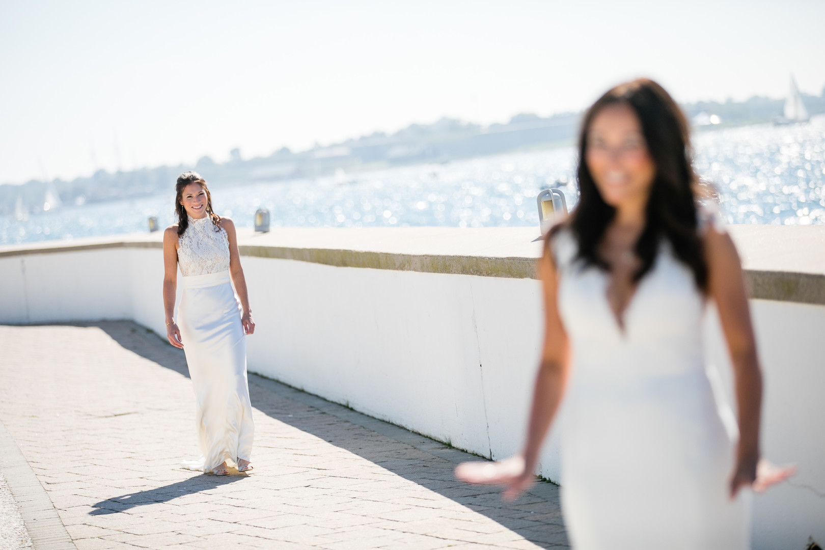 Black and white beach wedding in Newport, Rhode Island lesbian two brides long white dresses Newport Beach House first look