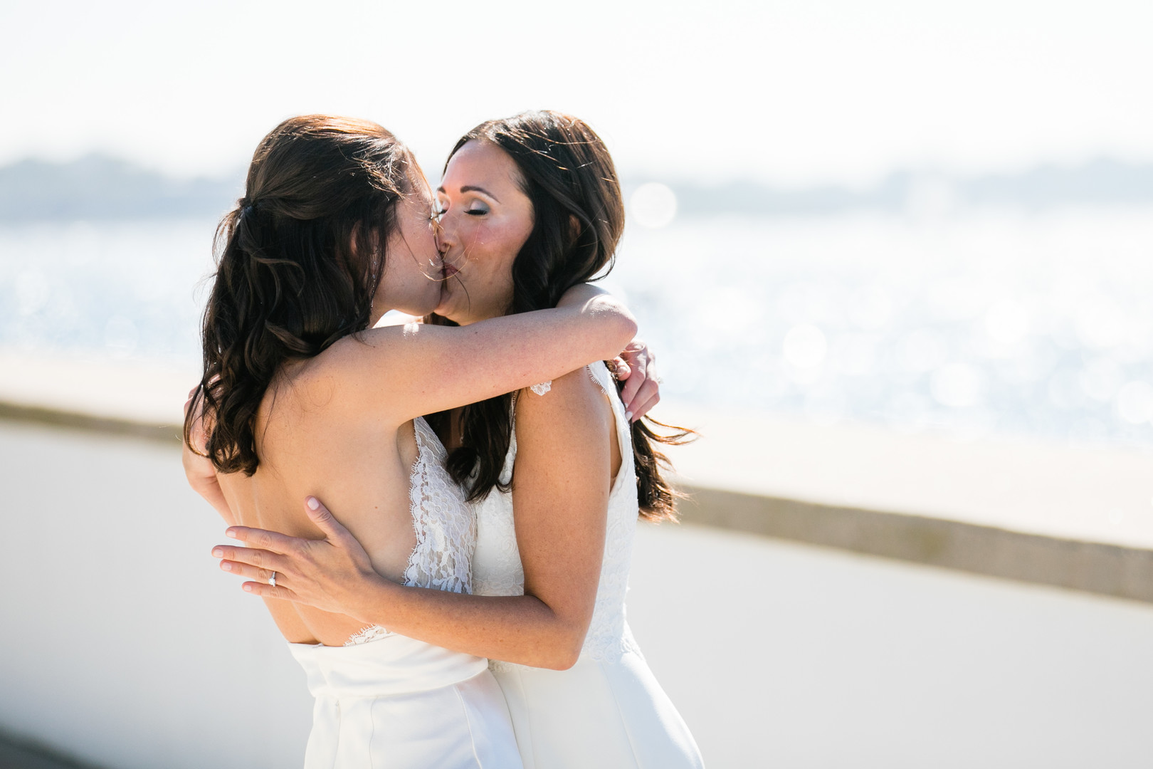 Black and white beach wedding in Newport, Rhode Island lesbian two brides long white dresses Newport Beach House