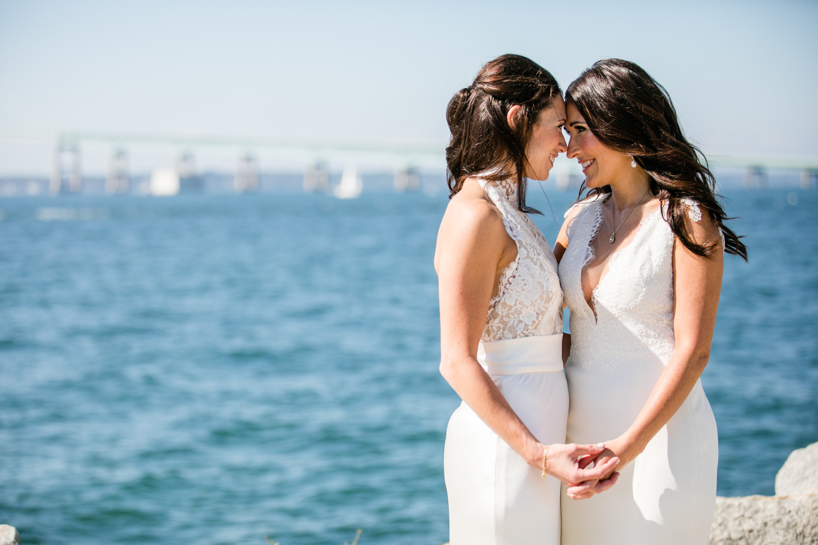 Black and white beach wedding in Newport, Rhode Island lesbian two brides long white dresses Newport Beach House