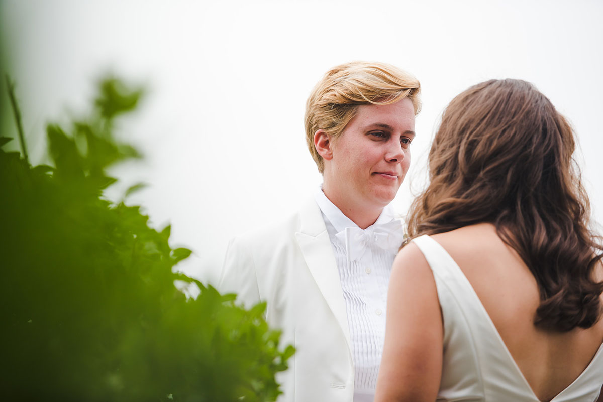 Cape Cod chapel wedding in Provincetown, Massachusetts first look two brides white tux white dress Kate Spade glitter Keds First Parish Provincetown Inn