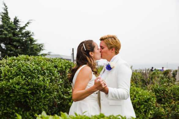 Cape Cod chapel wedding in Provincetown, Massachusetts first look two brides white tux white dress Kate Spade glitter Keds First Parish Provincetown Inn kiss