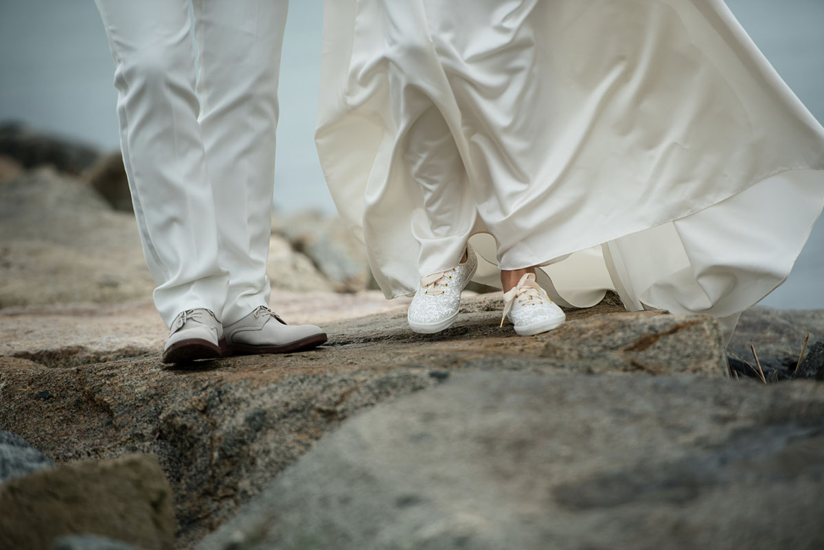 Cape Cod chapel wedding in Provincetown, Massachusetts first look two brides white tux white dress Kate Spade glitter Keds First Parish Provincetown Inn