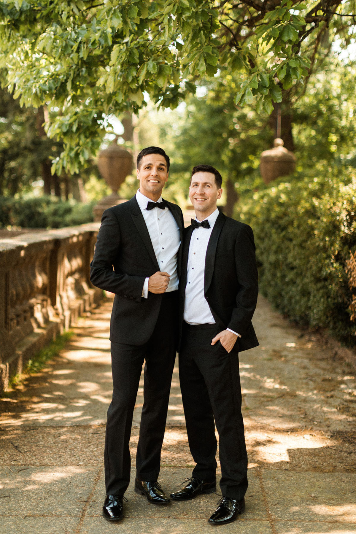 Energetic, colorful wedding in Washington, D.C. two grooms bow ties black tuxedos