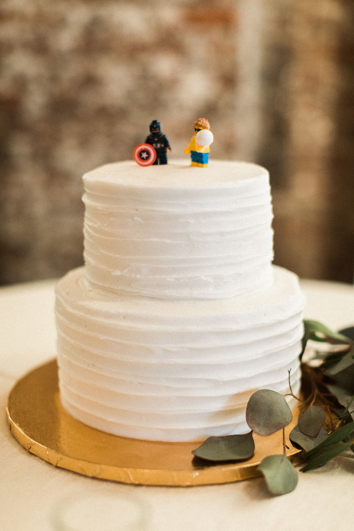 Energetic, colorful wedding in Washington, D.C. two tier cream cake Lego cake toppers