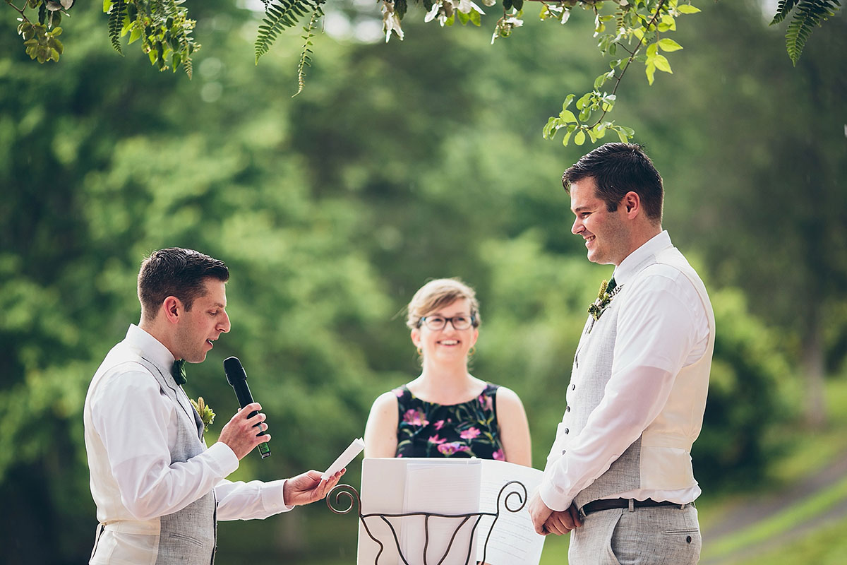 Flower farm wedding with s'mores bar two grooms gay queer wedding elopement grey suits matching