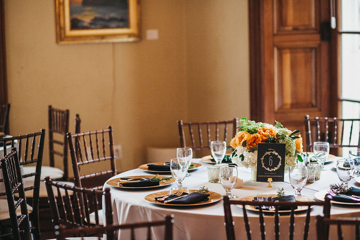 Historic hometown wedding in Pasadena, California table setting orange flowers