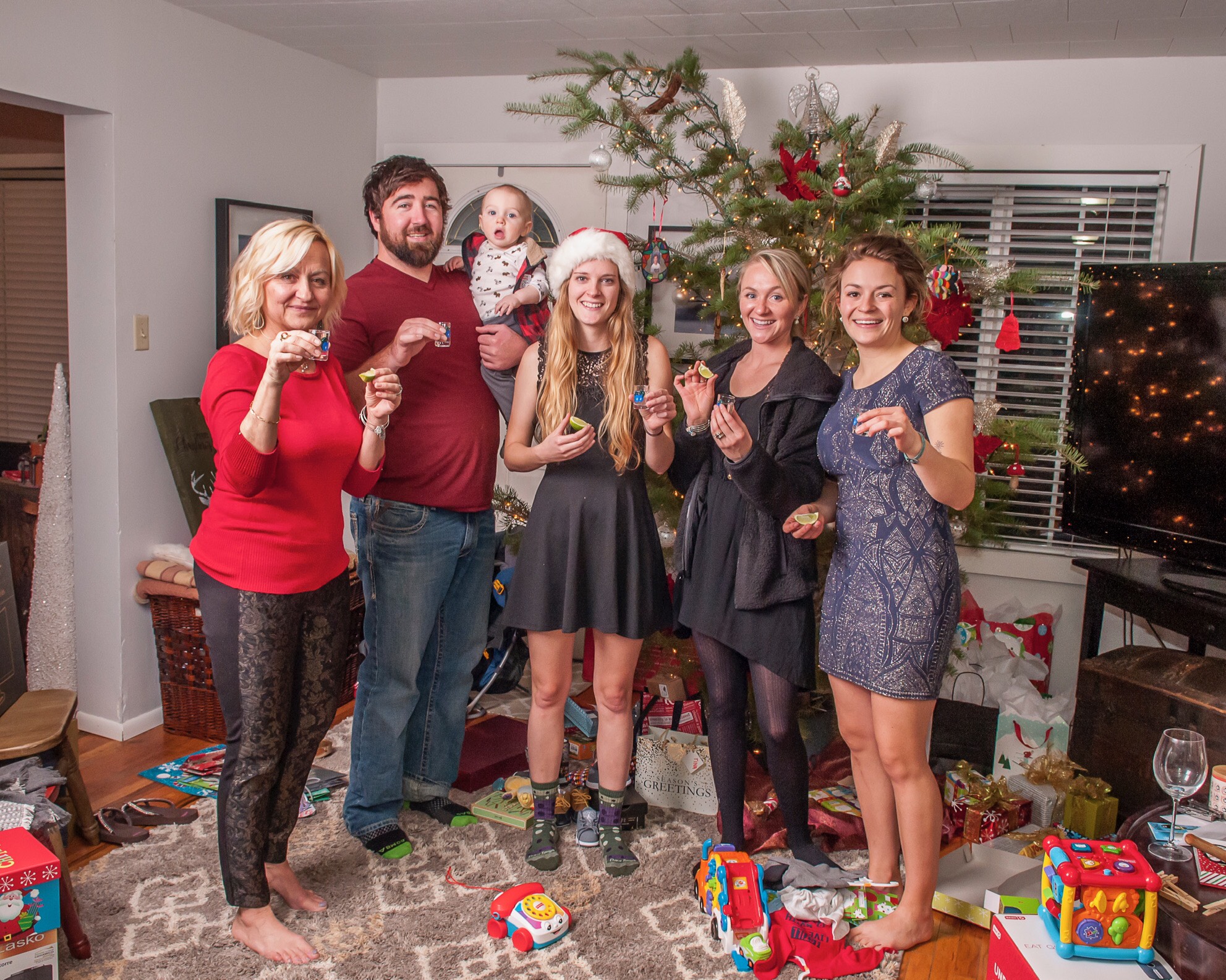 Here's how LGBTQ+ couples are spending the holidays together Alaina Fister Lucie and family tequila shot