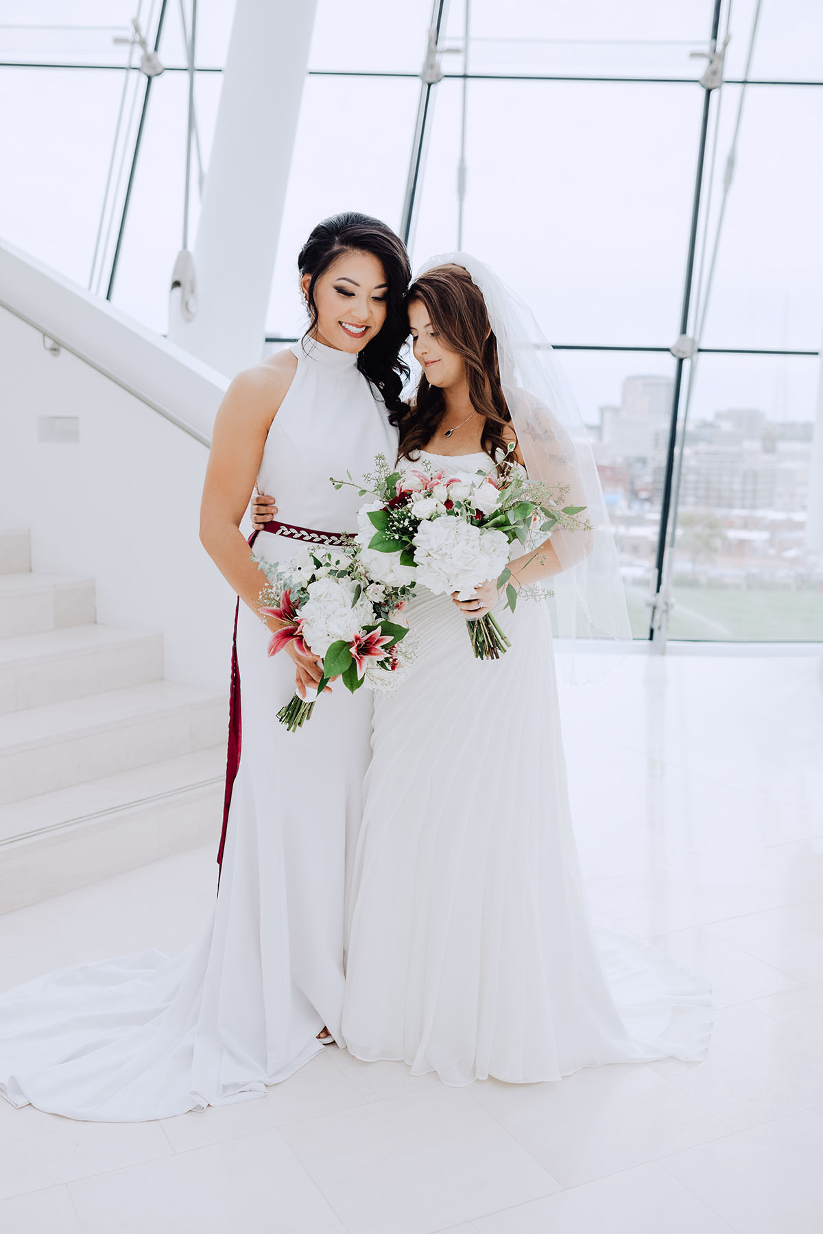 Modern rooftop wedding in Kansas City, Kansas Asian-American lesbian wedding long white dresses