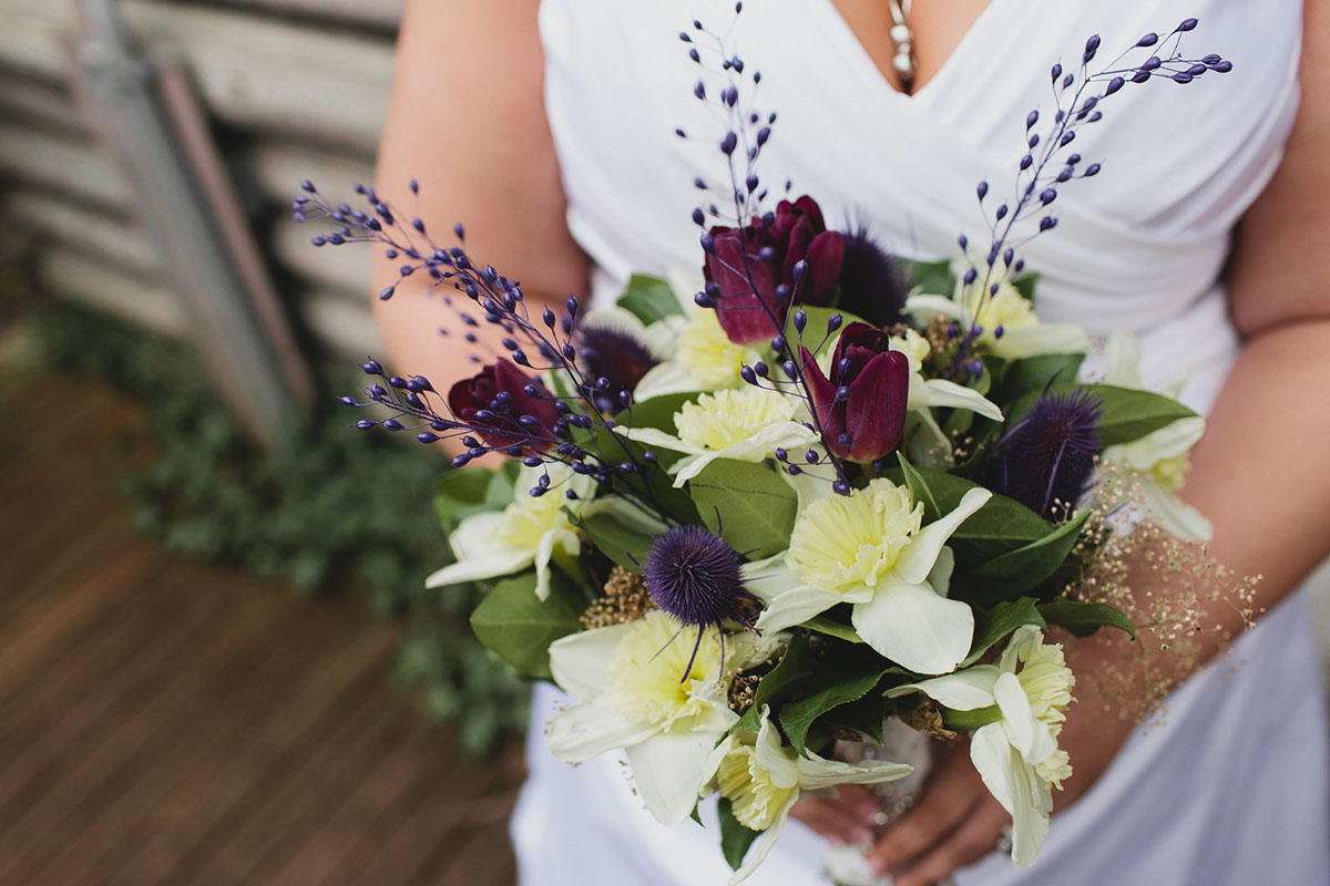 Purple greenhouse wedding with goats white dress purple burgundy bouquet