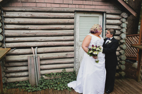 Purple greenhouse wedding with goats two brides lesbian wedding black tuxedo white dress