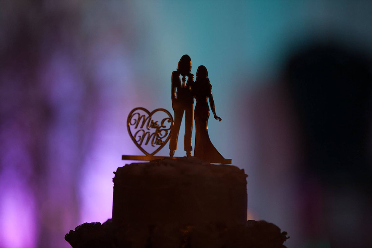 Spiritual geometry-themed wedding Mrs. and Mrs. wedding cake topper