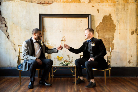 Blue and gold New Year's Eve elopement inspiration all black party black tuxedos two grooms bow ties toast champagne