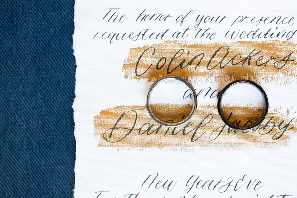 Blue and gold New Year's Eve elopement inspiration luxurious opulent wedding rings invitations rustic handmade