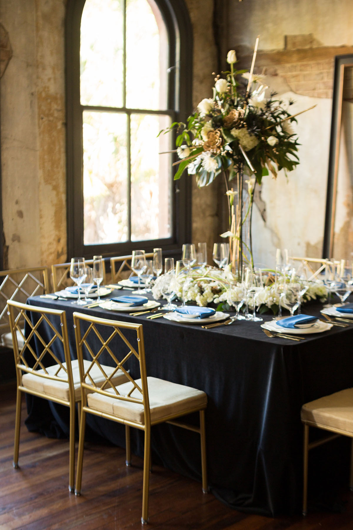 Blue and gold New Year's Eve elopement inspiration rustic luxurious southern floral navy table settings