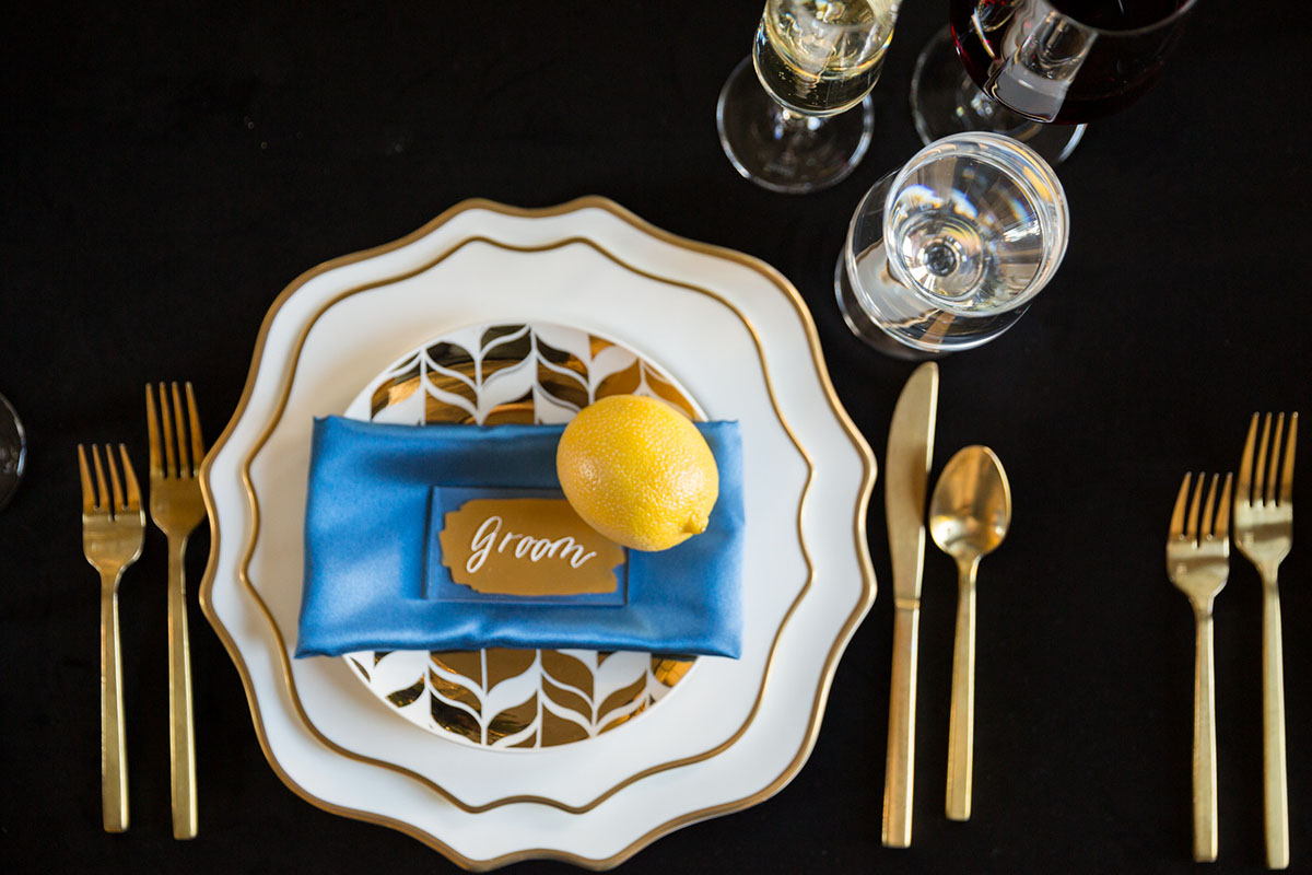 Blue and gold New Year's Eve elopement inspiration rustic luxurious southern floral navy table settings
