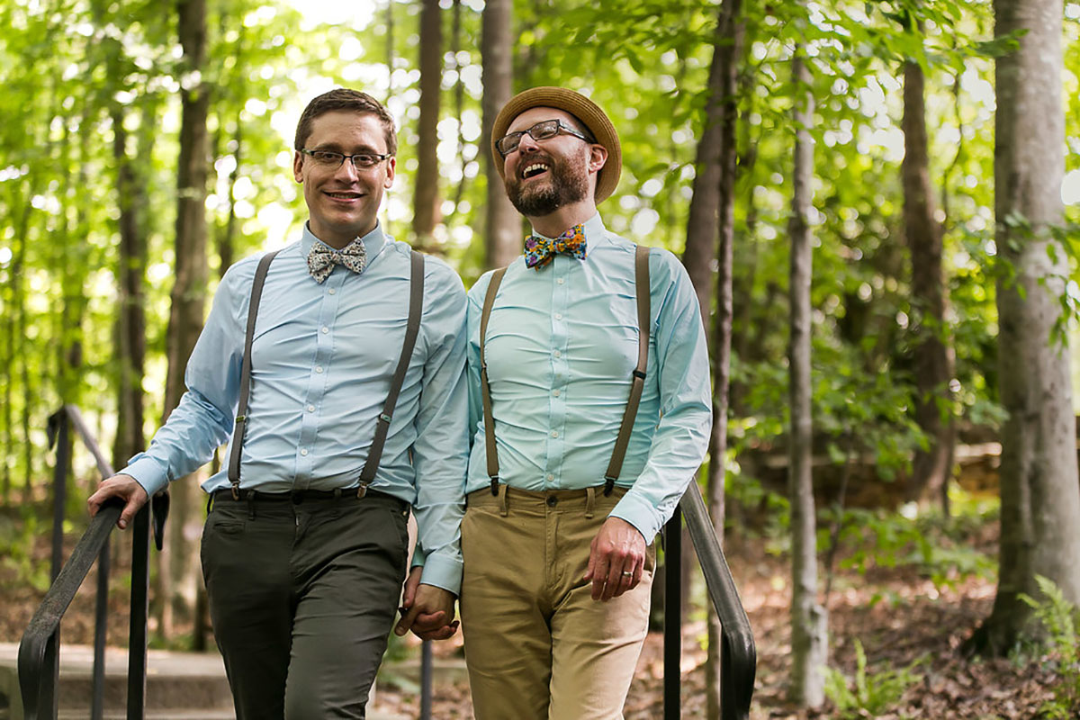 Casual outdoor wedding at the Garden Club of Georgia two grooms suspenders colorful bow ties fun eclectic
