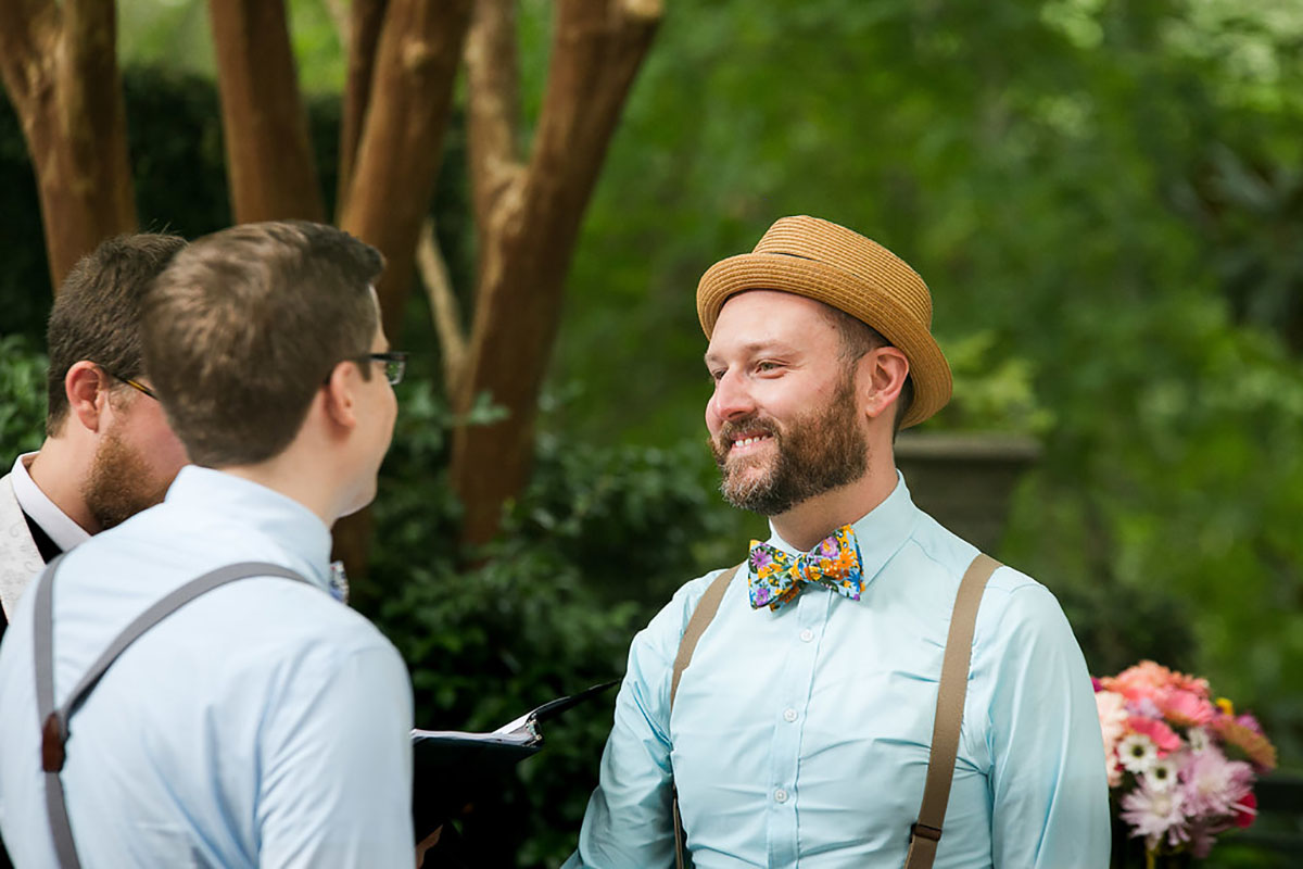 Casual outdoor wedding at the Garden Club of Georgia two grooms suspenders colorful bow ties fun eclectic vows