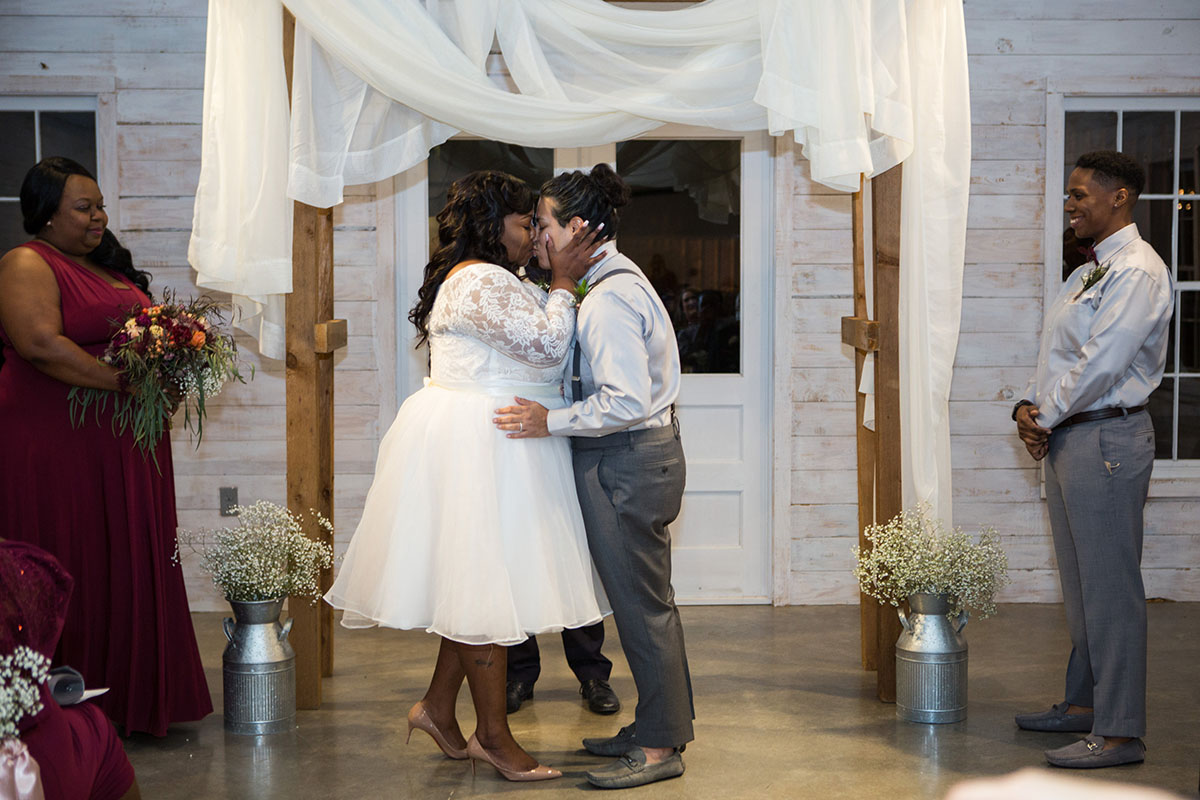 Historic mill wedding in Clifton, Texas custom Pinterest tulle lace wedding dress Men's Wearhouse suspenders