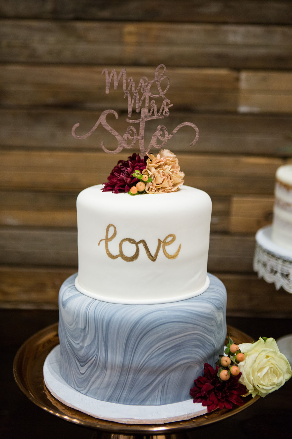 Historic mill wedding in Clifton, Texas gold marbled burgundy cake