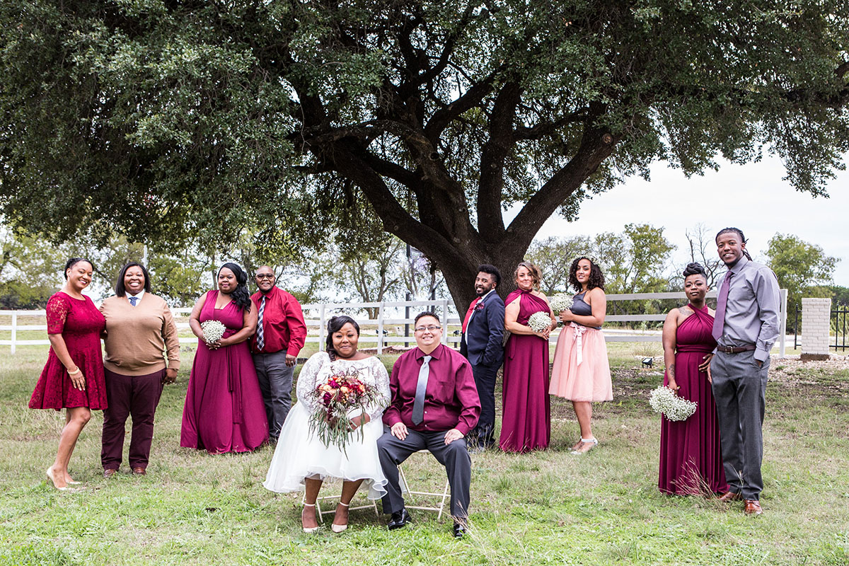 Historic mill wedding in Clifton, Texas burgundy red wedding party