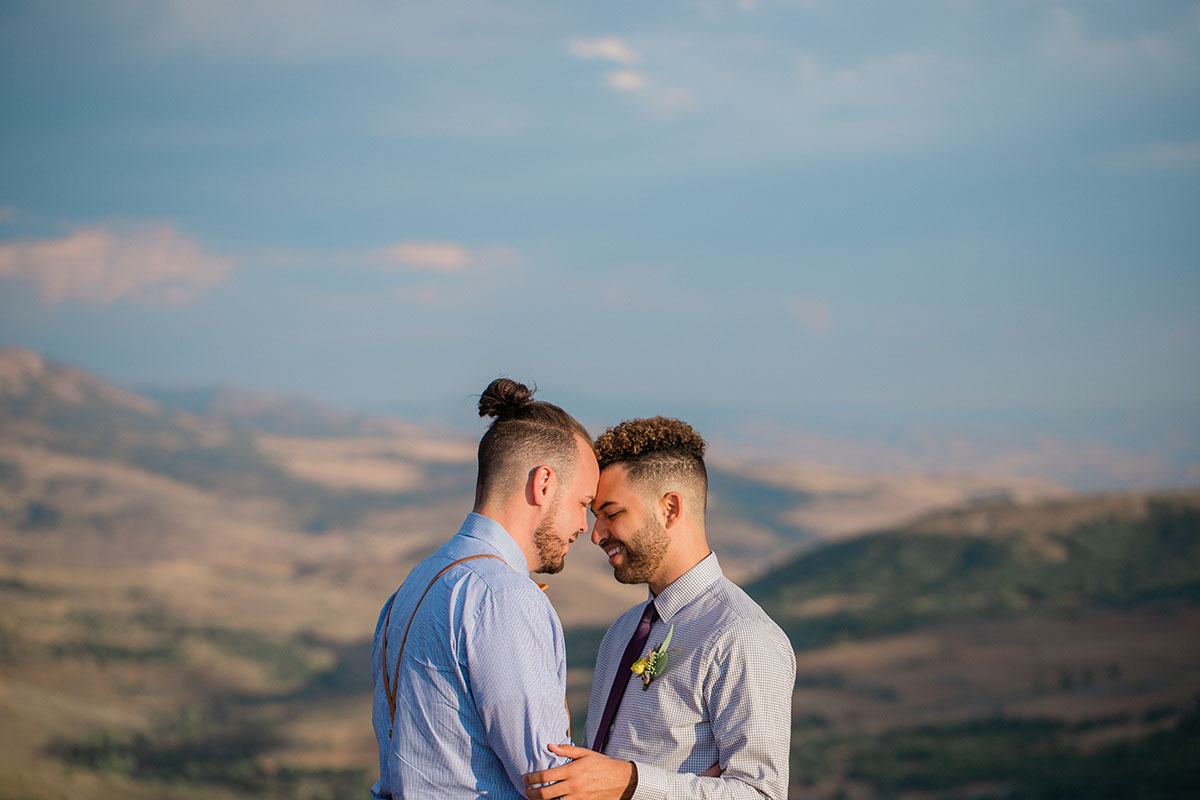 Rustic mountain wedding at the Art Nord Trailhead two grooms suspenders bow tie Syracuse, Utah short ponytail