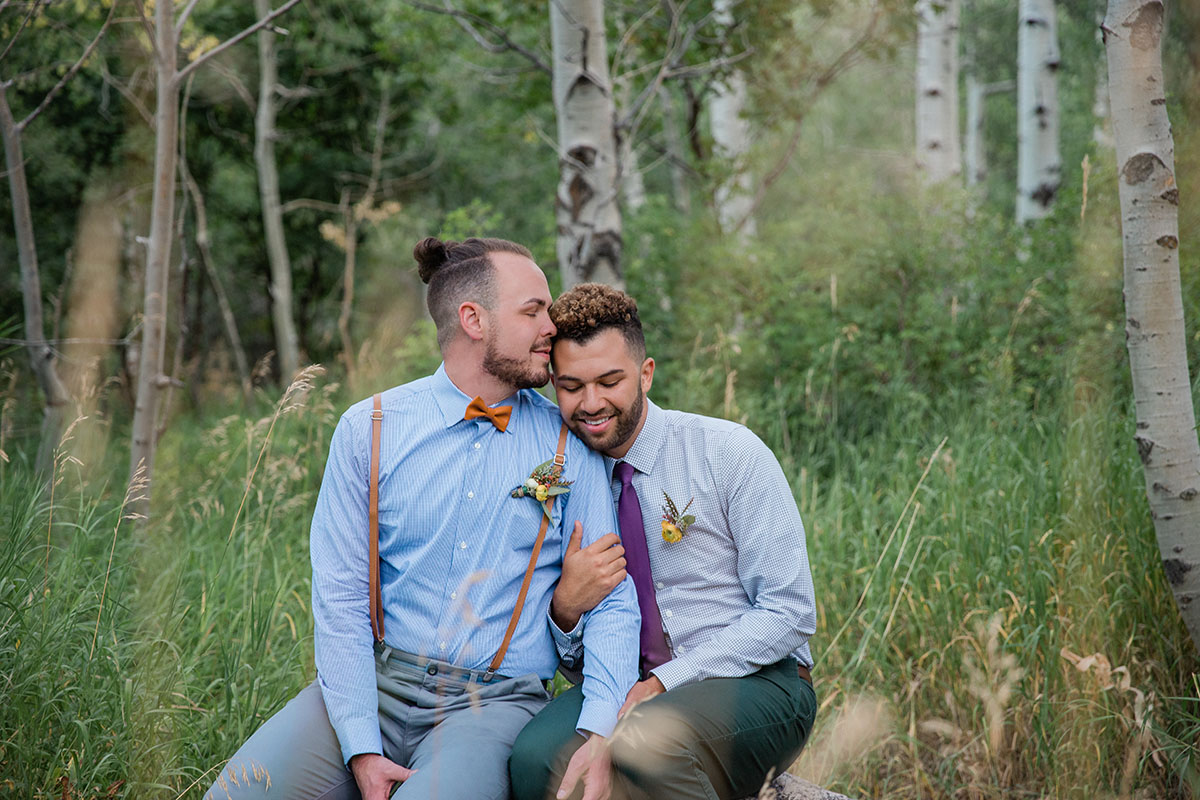 Rustic mountain wedding at the Art Nord Trailhead two grooms suspenders bow tie Syracuse, Utah short ponytail