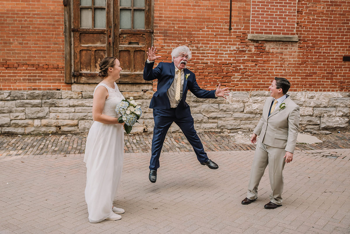 Rustic winery wedding in Columbus, Ohio exposed brick grey tuxedo long white tulle dress two brides