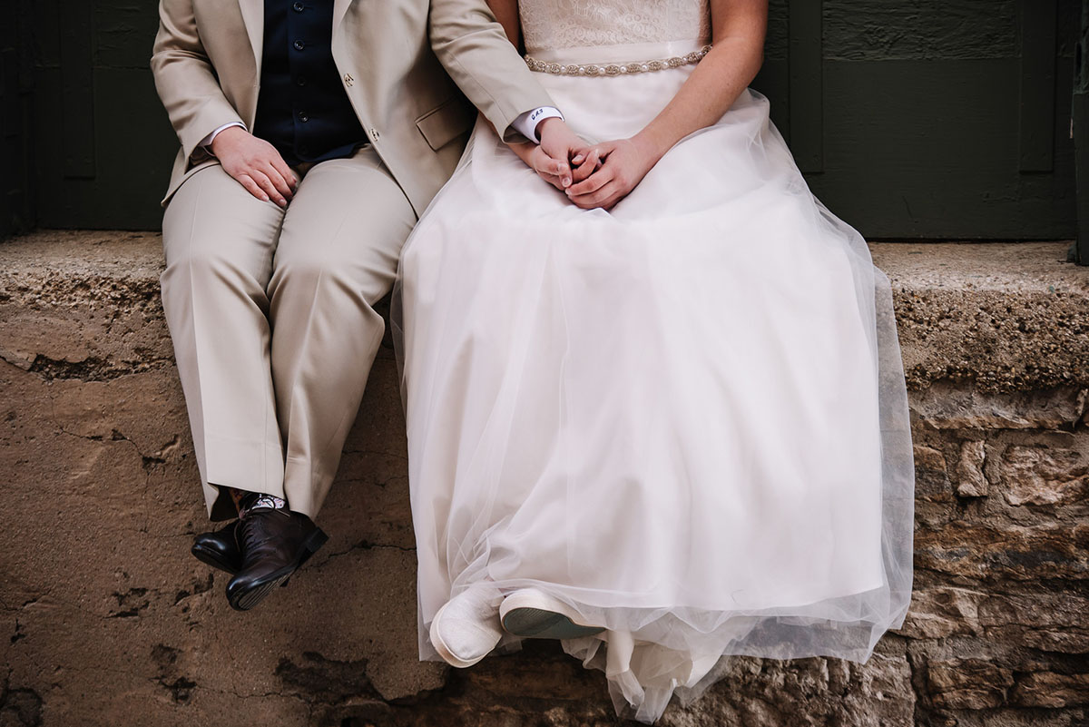 Rustic winery wedding in Columbus, Ohio exposed brick grey tuxedo long white tulle dress two brides